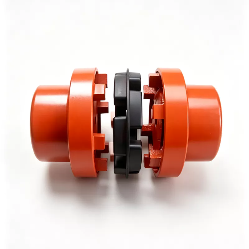 Exploded NM coupling with two orange hubs and black flexible element